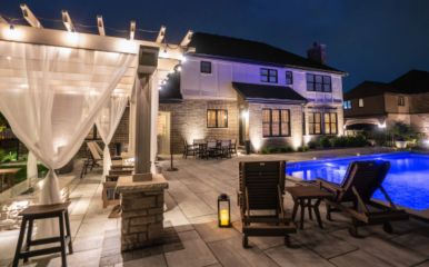 Pools, ponds, pergolas, and outdoor kitchens — extend usability into the night