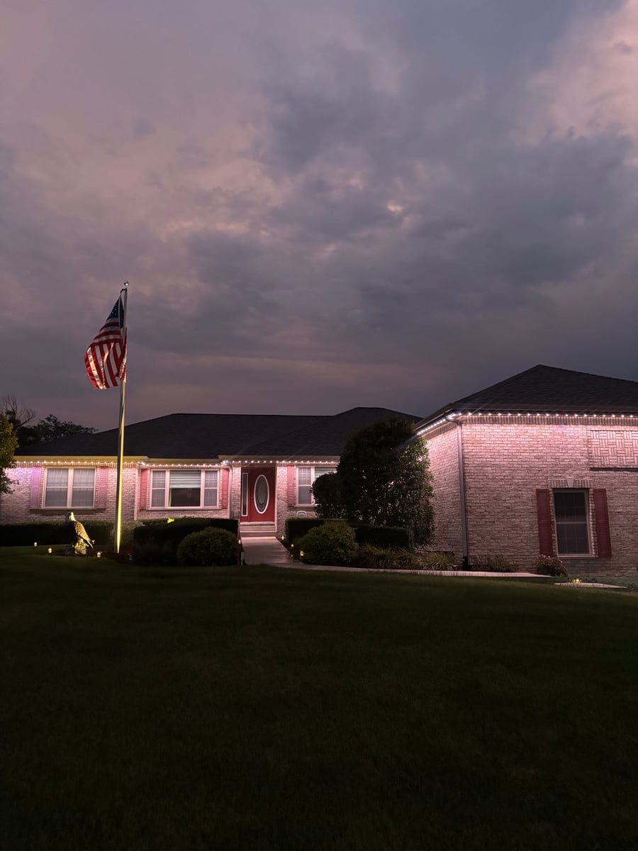 Permanent RGBW gemstone roofline holiday lighting installation