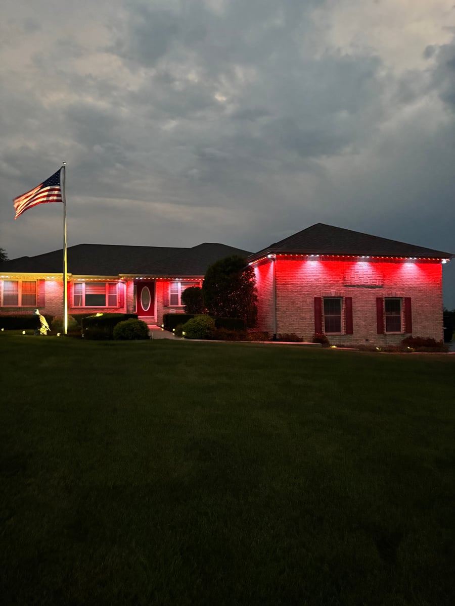 Permanent RGBW gemstone roofline holiday lighting installation