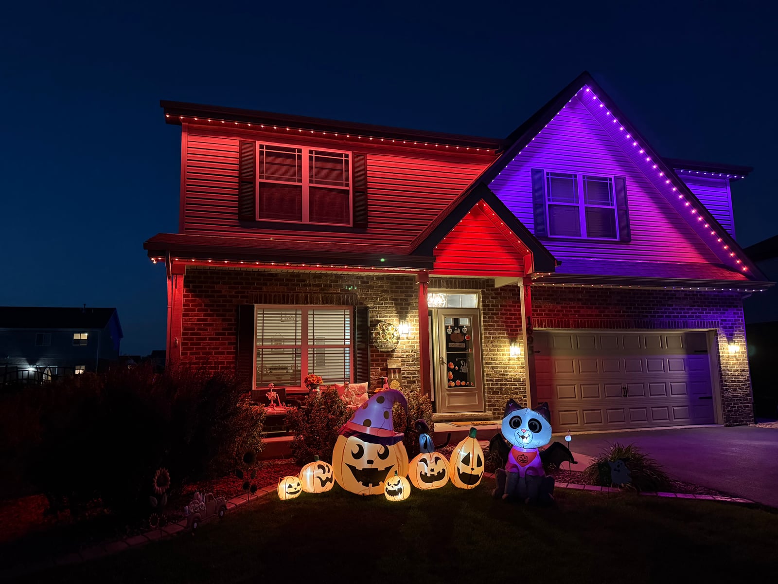 Permanent RGBW roofline holiday lighting installation